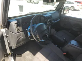 2004 Jeep Wrangler Sport with VIN 1J4FA49S94P751849, listed as a Copart auction lot 55519445 with 139,854 mi miles and Salvage title. Bid and sale history available at DreamBid. Image 8.