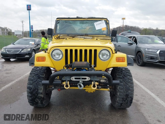 2000 Jeep Wrangler SE with VIN 1J4FA29P5YP705215, listed as a IAAI auction lot 41920532 with 92,927 mi miles and . Bid and sale history available at DreamBid. Image 13.