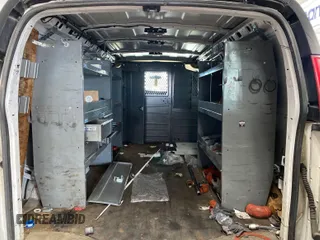 2015 Chevrolet Express Cargo Van with VIN 1GCWGFCF6F1215880, listed as a IAAI auction lot 42175576 with 189,599 mi miles. Bid and sale history available at carsss.com. Image 1.