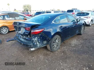 2020 Mazda 6 Sport with VIN JM1GL1UM5L1519519, listed as a IAAI auction lot 41920571 with 59,378 mi miles and . Bid and sale history available at DreamBid. Image 4.
