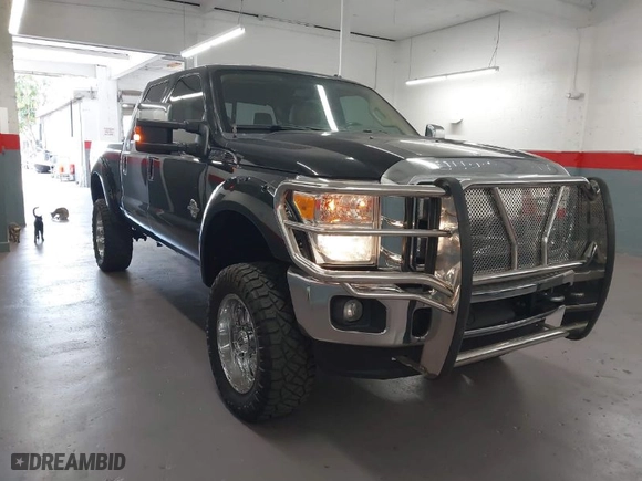 2015 Ford Super Duty F-250 SRW Lariat with VIN 1FT7W2BT1FED13599, listed as a IAAI auction lot 41987618 with 174,728 mi miles. Bid and sale history available at carsss.com. Image 1.