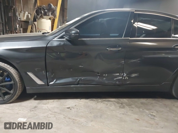 2017 BMW 5 Series 530i xDrive with VIN WBAJA7C35HG905401, listed as a IAAI auction lot 38089618 with 107,692 mi miles and . Bid and sale history available at carsss.com. Image 6.