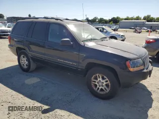 2004 Jeep Grand Cherokee Laredo with VIN 1J4GW48S84C182135, listed as a Copart auction lot 62224975 with 187,938 mi miles and Clean title. Bid and sale history available at DreamBid. Image 4.