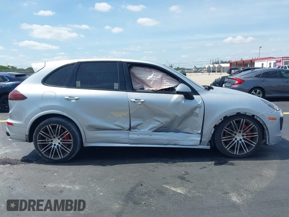 2016 Porsche Cayenne GTS z VIN WP1AD2A27GLA76018, wystawiony jako IAAI lot #42209515 z przebiegiem 49 432 mil mil oraz . Historia ofert i sprzedaży dostępna na DreamBid. Obrazek 13.