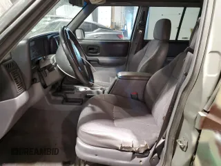 1998 Jeep Cherokee Sport with VIN 1J4FJ68S7WL269467, listed as a Copart auction lot 58664135 with 187,741 mi miles and Clean title. Bid and sale history available at DreamBid. Image 7.