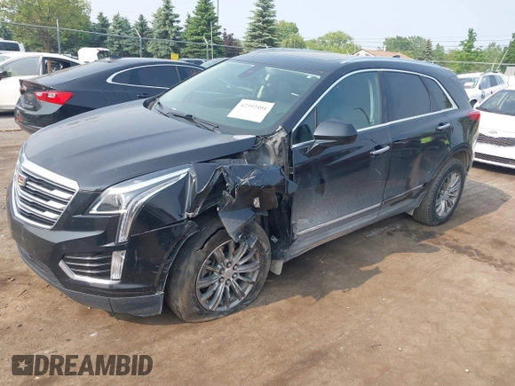 2018 Cadillac XT5 Luxury AWD with VIN 1GYKNDRSXJZ247863, listed as a IAAI auction lot 42392404 with 96,629 mi miles and . Bid and sale history available at DreamBid. Image 2.