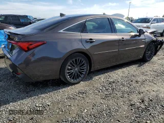 2019 Toyota Avalon Limited Hybrid z VIN 4T1B21FBXKU003688, wystawiony jako Copart lot #69697502 z przebiegiem 48 950 mil mil oraz . Historia ofert i sprzedaży dostępna na DreamBid. Obrazek 3.
