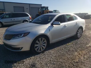 2014 Lincoln MKS EcoBoost z VIN 1LNHL9FT9EG606097, wystawiony jako Copart lot #57479085 z przebiegiem 179 040 mil mil oraz Czysty tytuł • Clean title. Historia ofert i sprzedaży dostępna na DreamBid. Obrazek 1.
