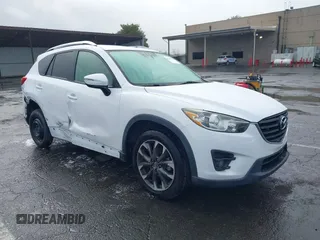 2016 Mazda CX-5 Grand Touring z VIN JM3KE4DY8G0774712, wystawiony jako IAAI lot #42244912 z przebiegiem 97 652 mil mil oraz . Historia ofert i sprzedaży dostępna na DreamBid. Obrazek 1.