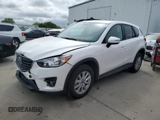 2016 Mazda CX-5 Touring with VIN JM3KE2CYXG0777715, listed as a Copart auction lot 52157005 with 58,585 mi miles and Salvage Title. Bid and sale history available at carsss.com. Image 1.