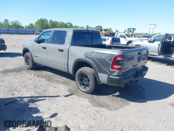 2023 Ram 1500 Rebel with VIN 1C6SRFLT2PN677577, listed as a IAAI auction lot 41991668 with 20,507 mi miles and . Bid and sale history available at DreamBid. Image 3.