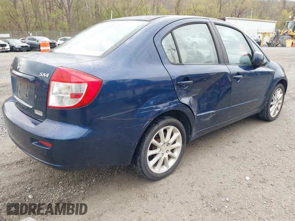 2011 Suzuki SX4 LE with VIN JS2YC5A23B6304713, listed as a IAAI auction lot 41997287 with 114,024 mi miles. Bid and sale history available at carsss.com. Image 4.