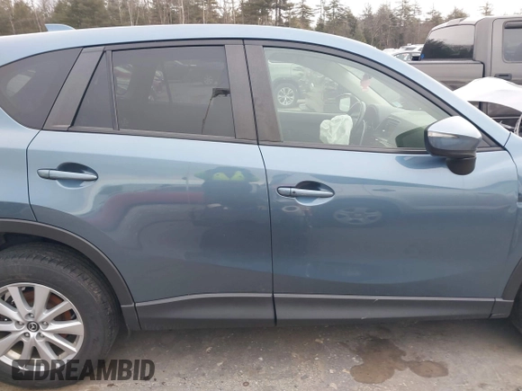 2015 Mazda CX-5 Touring with VIN JM3KE4CY1F0545305, listed as a IAAI auction lot 41234599 with 92,791 mi miles. Bid and sale history available at carsss.com. Image 13.