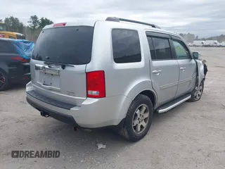 2011 Honda Pilot Touring with VIN 5FNYF4H90BB022354, listed as a IAAI auction lot 41965082 with 126,505 mi miles and . Bid and sale history available at carsss.com. Image 4.