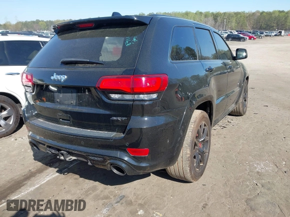 2017 Jeep Grand Cherokee SRT with VIN 1C4RJFDJ2HC696025, listed as a IAAI auction lot 41863274 with 126,949 mi miles. Bid and sale history available at carsss.com. Image 4.