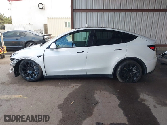 2023 Tesla Model Y Long Range with VIN 7SAYGAEE0PF787216, listed as a IAAI auction lot 41589954 with 17,985 mi miles and . Bid and sale history available at DreamBid. Image 15.