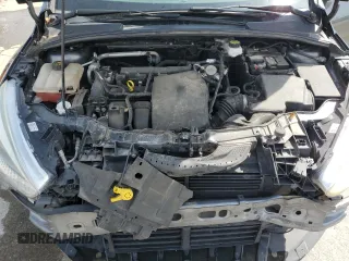 2018 Ford Focus SE z VIN 1FADP3F24JL204488, wystawiony jako Copart lot #54733625 z przebiegiem Nie podano mil oraz Szkoda całkowita • Salvage title. Historia ofert i sprzedaży dostępna na DreamBid. Obrazek 11.