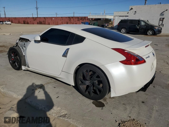 2014 Nissan 370Z Nismo with VIN JN1AZ4EH0EM635111, listed as a Copart auction lot 87292134 with 185,356 mi miles and Salvage Title. Bid and sale history available at DreamBid. Image 2.