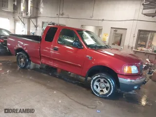 2004 Ford F-150 Heritage XL with VIN 2FTRX18W74CA40690, listed as a IAAI auction lot 41507958 with 182,136 mi miles. Bid and sale history available at carsss.com. Image 1.