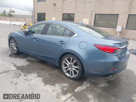 2014 Mazda 6 i Grand Touring with VIN JM1GJ1W64E1133729, listed as a IAAI auction lot 42050222 with 112,464 mi miles and . Bid and sale history available at DreamBid. Image 3.