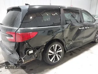 2023 Honda Odyssey Touring z VIN 5FNRL6H85PB039450, wystawiony jako IAAI lot #41504351 z przebiegiem 51 000 mil mil oraz . Historia ofert i sprzedaży dostępna na DreamBid. Obrazek 6.