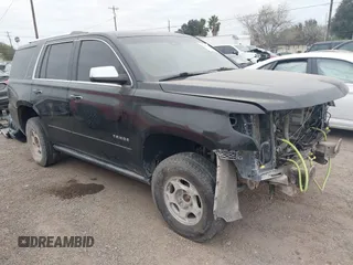 2015 Chevrolet Tahoe LTZ z VIN 1GNSKCKCXFR199727, wystawiony jako IAAI lot #41203839 z przebiegiem 189 337 mil mil oraz . Historia ofert i sprzedaży dostępna na DreamBid. Obrazek 1.