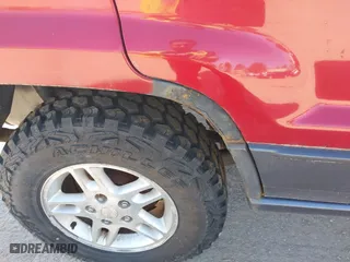 2003 Jeep Grand Cherokee Laredo with VIN 1J4GW48S33C556441, listed as a IAAI auction lot 42026804 with 189,143 mi miles. Bid and sale history available at carsss.com. Image 6.