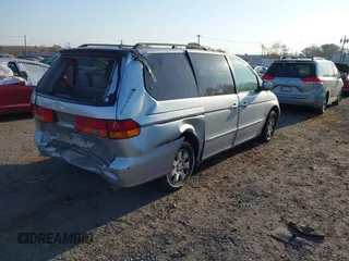 2004 Honda Odyssey EX-L with VIN 5FNRL18964B025323, listed as a IAAI auction lot 40714457 with 164,786 mi miles and . Bid and sale history available at DreamBid. Image 4.