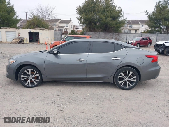 2018 Nissan Maxima S with VIN 1N4AA6AP0JC384660, listed as a IAAI auction lot 41617587 with 121,463 mi miles and . Bid and sale history available at DreamBid. Image 14.
