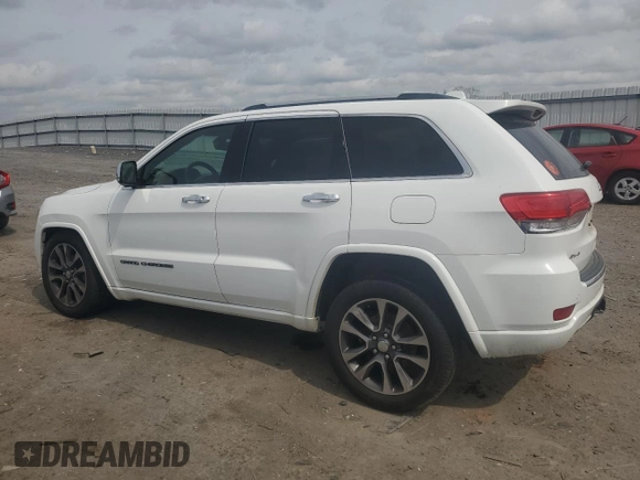 2018 Jeep Grand Cherokee Overland with VIN 1C4RJFCG5JC437508, listed as a Copart auction lot 51814795 with 104,598 mi miles and Salvage title. Bid and sale history available at DreamBid. Image 2.
