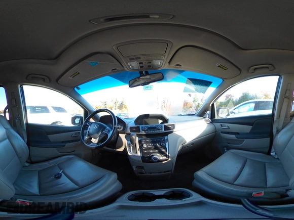 2012 Honda Odyssey Touring with VIN 5FNRL5H9XCB067841, listed as a IAAI auction lot 40631672 with 210,237 mi miles and . Bid and sale history available at DreamBid. Image 24.