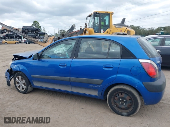 2009 Kia Rio LX with VIN KNADE243296494243, listed as a IAAI auction lot 41307888 with 133,487 mi miles. Bid and sale history available at carsss.com. Image 14.