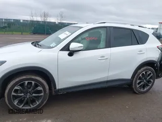 2016 Mazda CX-5 Grand Touring z VIN JM3KE4DY0G0705884, wystawiony jako IAAI lot #42016910 z przebiegiem 73 324 mil mil oraz . Historia ofert i sprzedaży dostępna na DreamBid. Obrazek 14.