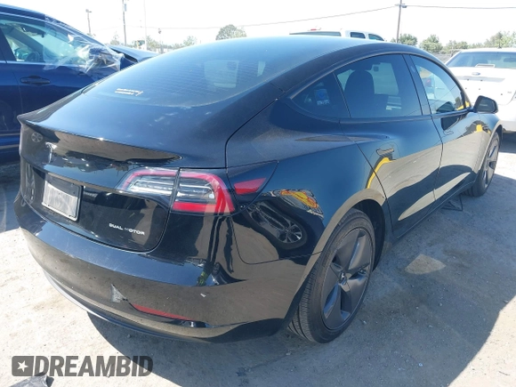 2021 Tesla Model 3 Long Range with VIN 5YJ3E1EB2MF065583, listed as a IAAI auction lot 42067399 with 52,333 mi miles. Bid and sale history available at carsss.com. Image 4.