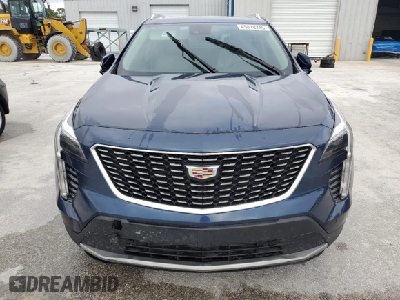 2021 Cadillac XT4 FWD Premium Luxury z VIN 1GYFZCR48MF056210, wystawiony jako Copart lot #45818245 z przebiegiem Nie podano mil oraz Nie do naprawy • Non repairable. Historia ofert i sprzedaży dostępna na DreamBid. Obrazek 5.