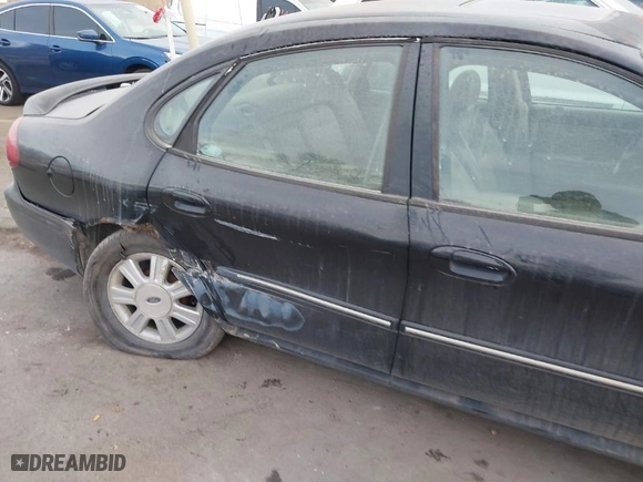 2004 Ford Taurus SEL with VIN 1FAHP56S44A129658, listed as a IAAI auction lot 41381122 with 298,335 mi miles. Bid and sale history available at carsss.com. Image 6.