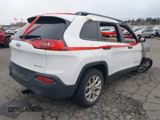 2016 Jeep Cherokee Altitude with VIN 1C4PJLAB7GW324163, listed as a IAAI auction lot 41605604 with 132,450 mi miles. Bid and sale history available at carsss.com. Image 4.