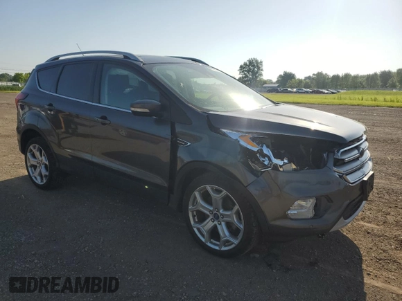 2019 Ford Escape Titanium with VIN 1FMCU0J96KUB22884, listed as a Copart auction lot 61979665 with 63,824 mi miles and Salvage title. Bid and sale history available at DreamBid. Image 4.