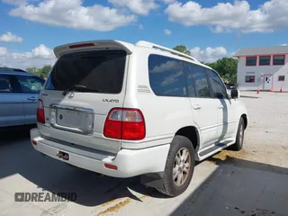 2003 Lexus LX 470 with VIN JTJHT00WX33523623, listed as a IAAI auction lot 42028889 with 317,700 mi miles and . Bid and sale history available at DreamBid. Image 4.