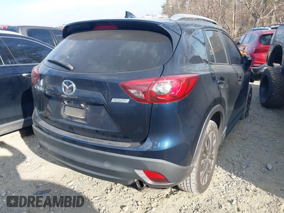 2016 Mazda CX-5 Grand Touring with VIN JM3KE2DY1G0708572, listed as a IAAI auction lot 41685298 with 109,427 mi miles. Bid and sale history available at carsss.com. Image 4.
