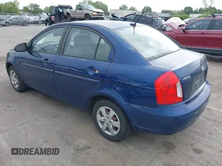 2009 Hyundai Accent Auto GLS with VIN KMHCN46C69U313921, listed as a IAAI auction lot 42011166 with 123,026 mi miles. Bid and sale history available at carsss.com. Image 3.