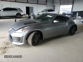 2009 Nissan 370Z с VIN JN1AZ44E69M405716, выставлен на аукционе Copart как лот 46036285 с пробегом 124 397 миль миль и Списание • Salvage title. История ставок и продаж доступна на DreamBid. Изображение 1.