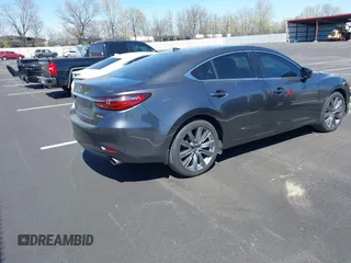 2020 Mazda 6 Grand Touring with VIN JM1GL1TY0L1522025, listed as a IAAI auction lot 41876429 with 68,101 mi miles and . Bid and sale history available at DreamBid. Image 4.
