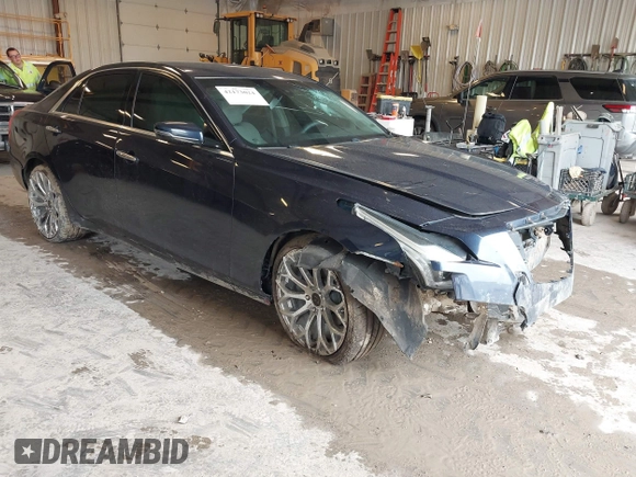 2015 Cadillac CTS AWD z VIN 1G6AW5SXXF0136481, wystawiony jako IAAI lot #42173024 z przebiegiem 128 984 mil mil oraz . Historia ofert i sprzedaży dostępna na DreamBid. Obrazek 1.