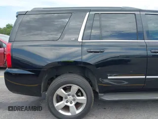 2015 Chevrolet Tahoe LT with VIN 1GNSCBKC4FR145119, listed as a IAAI auction lot 42309931 with 99,408 mi miles and . Bid and sale history available at DreamBid. Image 18.