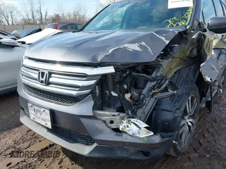 2017 Honda Pilot EX-L with VIN 5FNYF5H53HB029780, listed as a IAAI auction lot 41667838 with 104,803 mi miles. Bid and sale history available at carsss.com. Image 6.