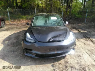 2020 Tesla Model 3 Standard Range Plus with VIN 5YJ3E1EA7LF598910, listed as a IAAI auction lot 42030288 with 95,811 mi miles. Bid and sale history available at carsss.com. Image 6.