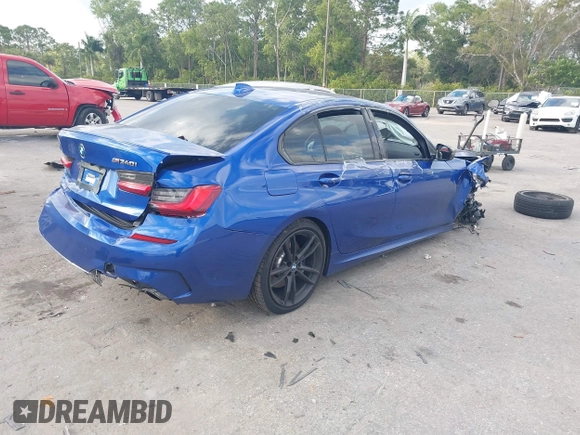 2020 BMW 3 Series M340i xDrive with VIN WBA5U9C00LA379345, listed as a IAAI auction lot 41256225 with 57,856 mi miles and . Bid and sale history available at DreamBid. Image 4.