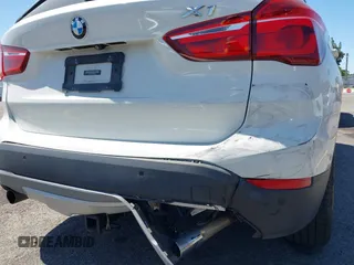 2017 BMW X1 xDrive28i with VIN WBXHT3C33H5F86831, listed as a IAAI auction lot 42019082 with 74,708 mi miles and . Bid and sale history available at DreamBid. Image 17.