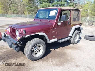 2002 Jeep Wrangler Sport with VIN 1J4FA49SX2P713303, listed as a IAAI auction lot 42136848 with 152,822 mi miles. Bid and sale history available at carsss.com. Image 2.